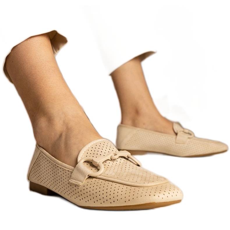 Beige women's openwork loafers with an ornament