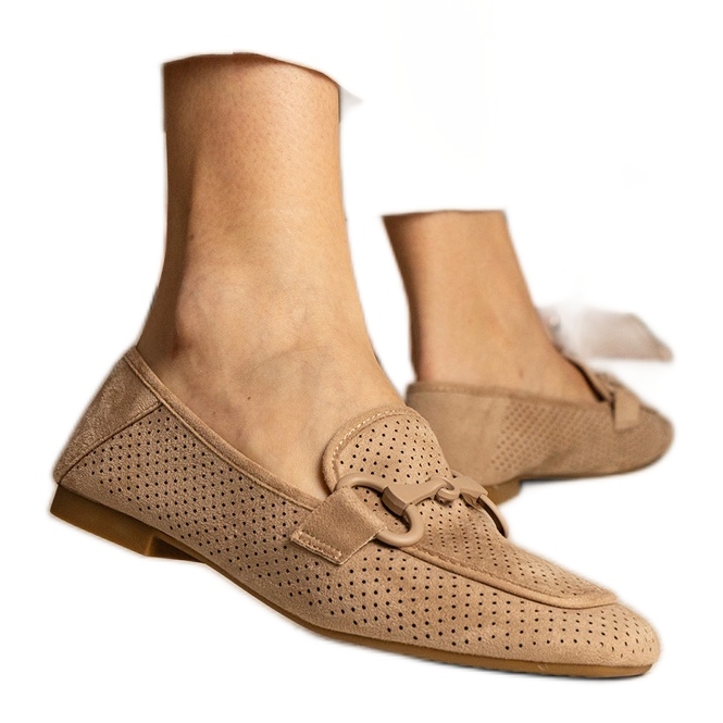 Brown women's openwork loafers with an ornament