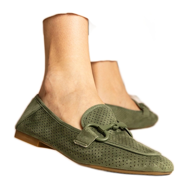 Green women's openwork loafers with an ornament