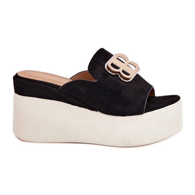 Slippers on the platform and wedges with a black decoration