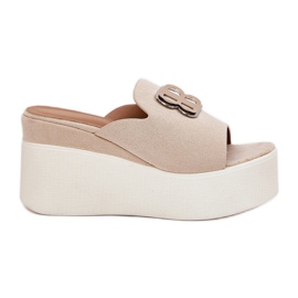 Slippers on the platform and wedges with beige ornament