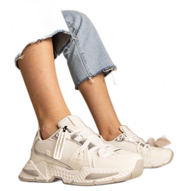 White women's sneakers with a massive sole