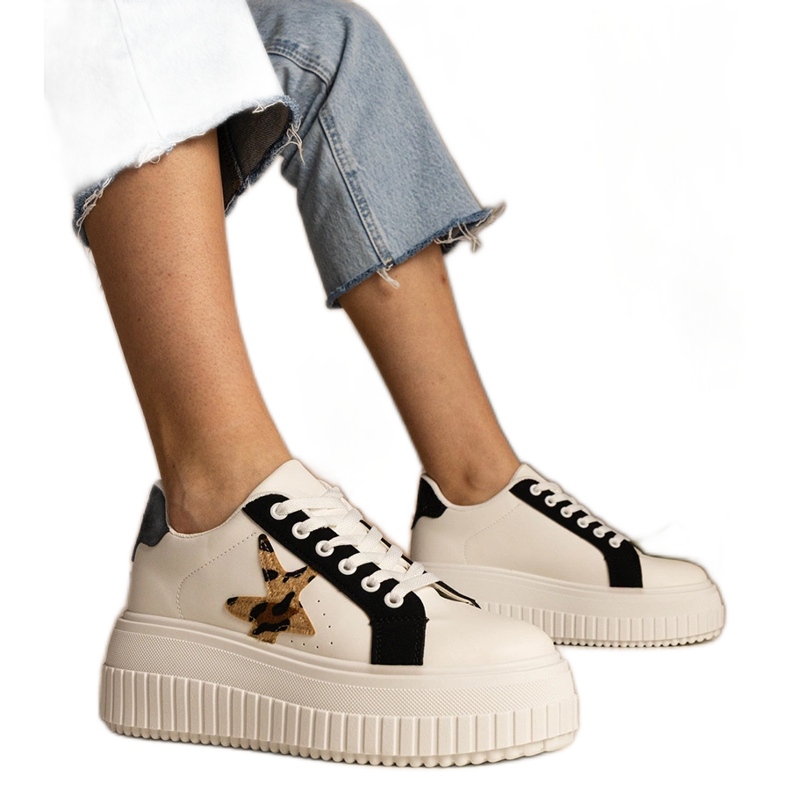 Black and white sneakers decorated with glitter and star Black and white sneakers decorated with glitter and star