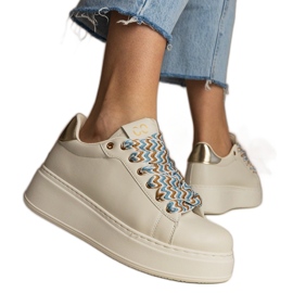 Beige women's sneakers with massive lacing