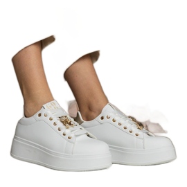 Women's white and gold sneakers decorated with stones