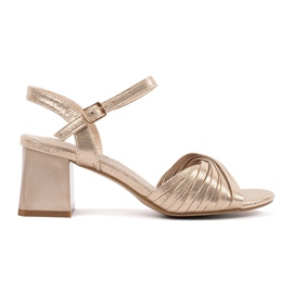 Goodin Golden elegant sandals on a low post