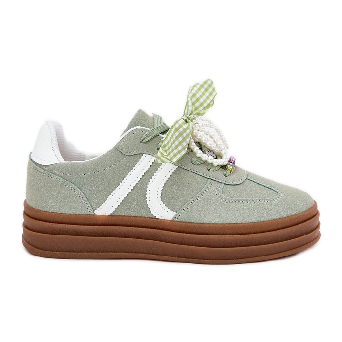 Women's sneakers on the platform with green ornaments Women's sneakers on the platform with green ornaments