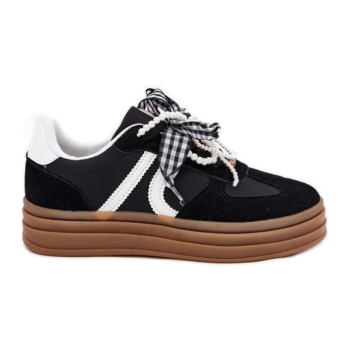 Women's sneakers on the platform with black decorations Women's sneakers on the platform with black decorations