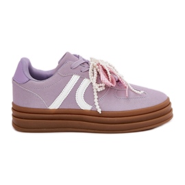 Women's sneakers on the platform with purple decorations