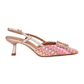 High heels with an ornament and an outdated champagne heel multicolored