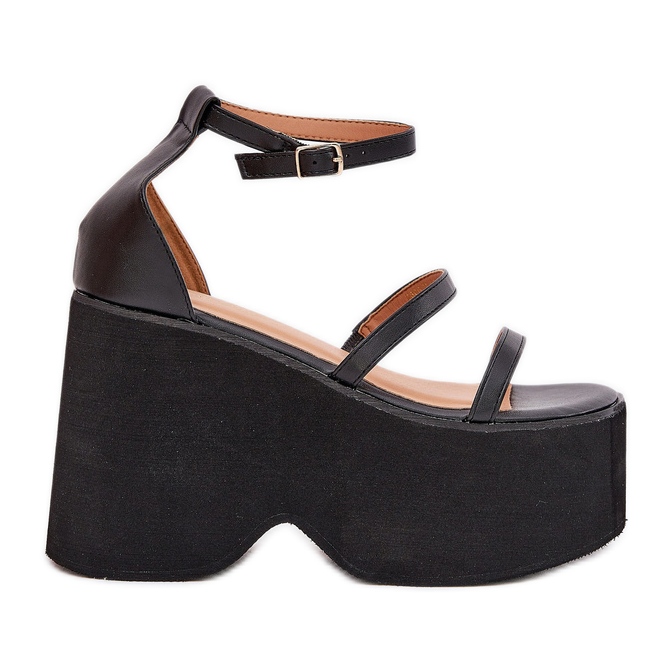 Women's sandals on a massive platform and black wedges