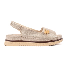 Goodin Gold sandals on the platform with a pin golden Goodin Gold sandals on the platform with a pin golden
