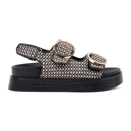 Goodin Sandals on a black and white platform