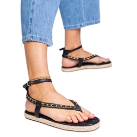 Black sandals decorated with a chain