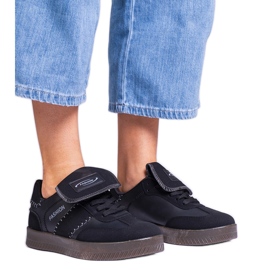 Black platform sneakers with stitching