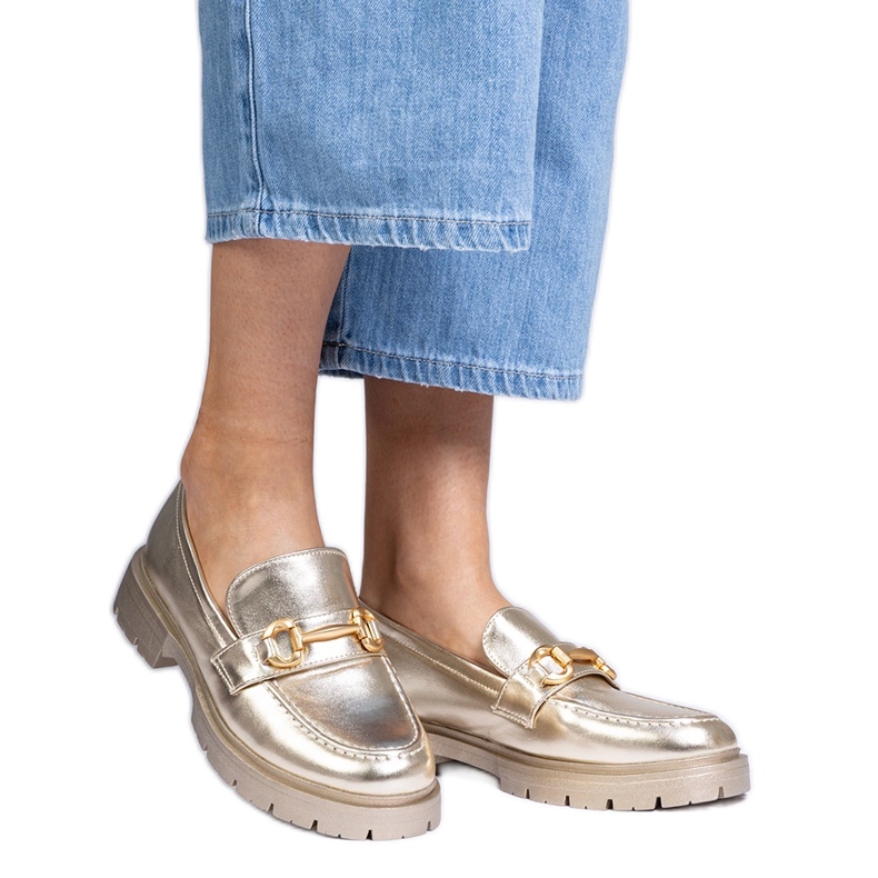 Golden elegant moccasins with decoration Golden elegant moccasins with decoration