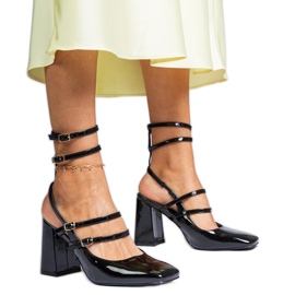 Black sandals varnished on the post