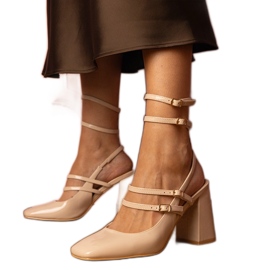 Beige lacquered pumps with a high heel