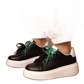 Black sports sneakers on the platform
