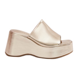 Eco leather women's slippers on the platform and gold wedges golden
