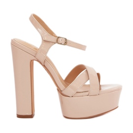 Women's sandals on a high post and platform varnished beige