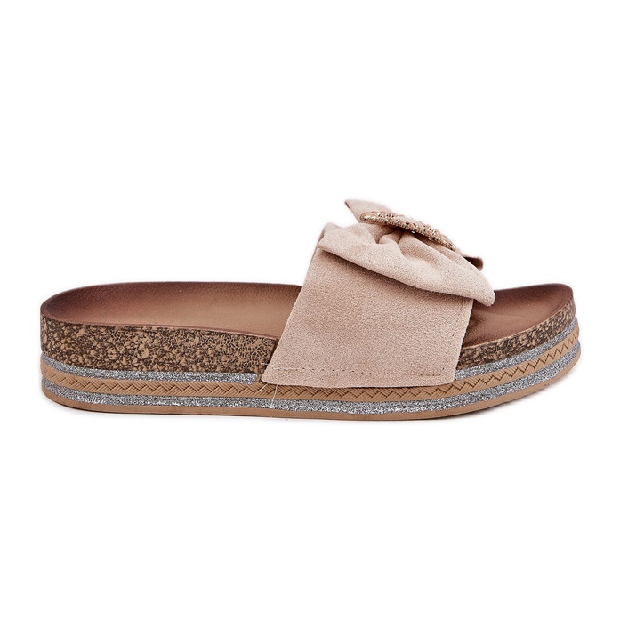 Women's flip flops on the platform with a bow and a decorative brooch beige