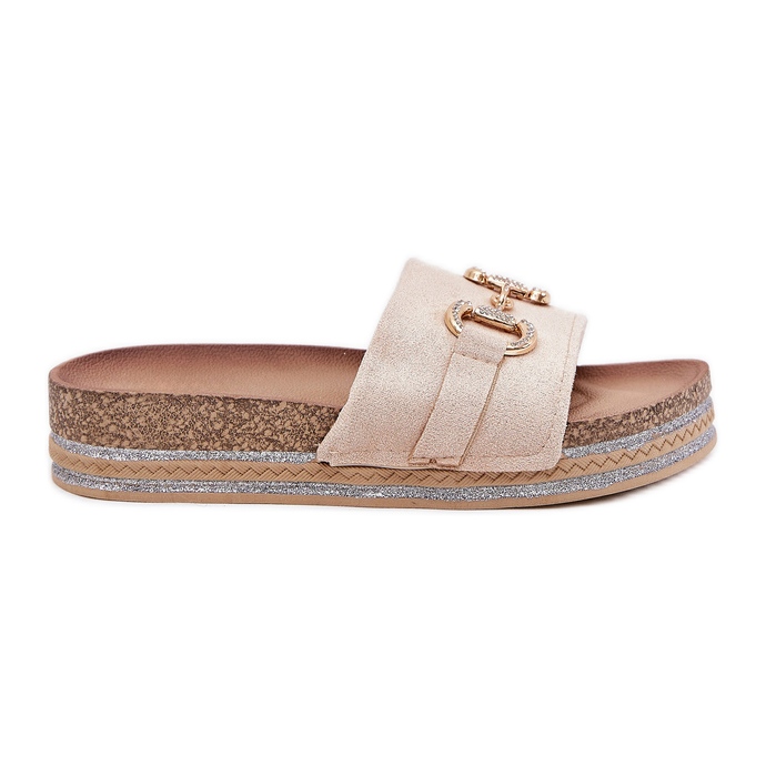 Women's flip flops on the platform with a golden ornament and beige glitter