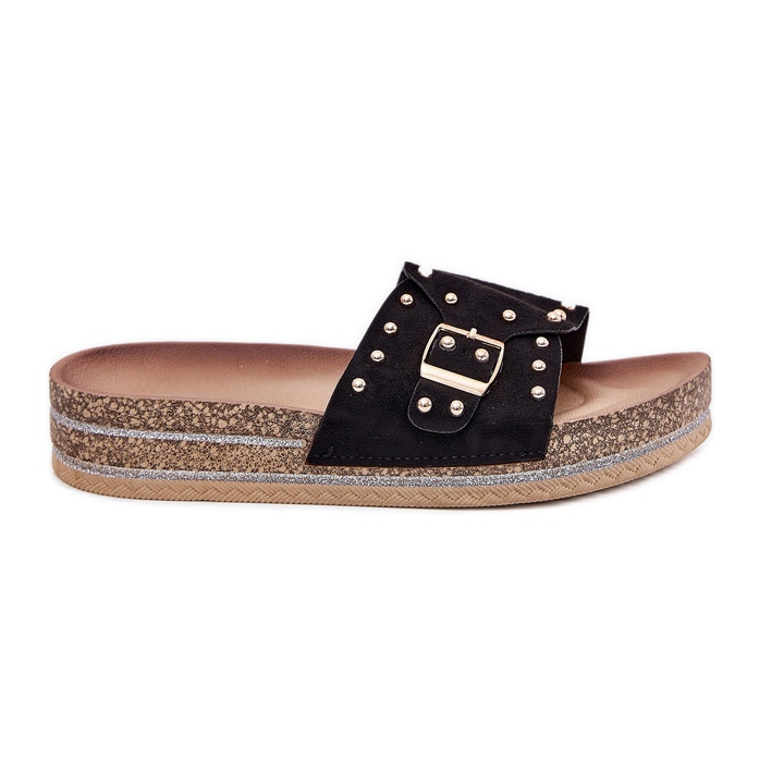 Women's slippers on the platform with a buckle and black studs