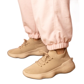 Beige sports sneakers with a socks upper