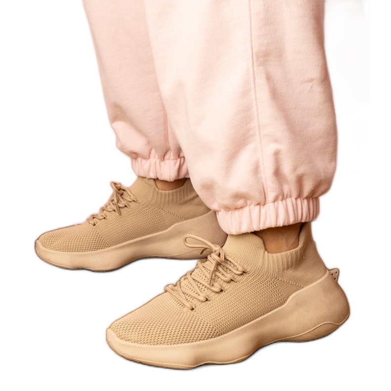 Beige sports sneakers with a socks upper