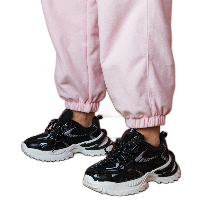 Black sports sneakers on a stylish sole