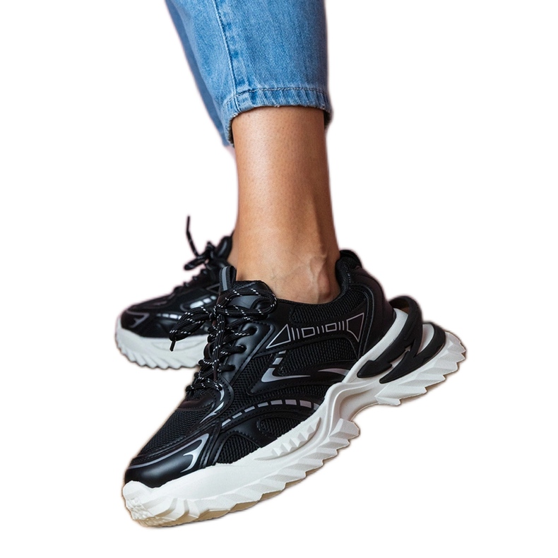 Black sports sneakers on a thick sole