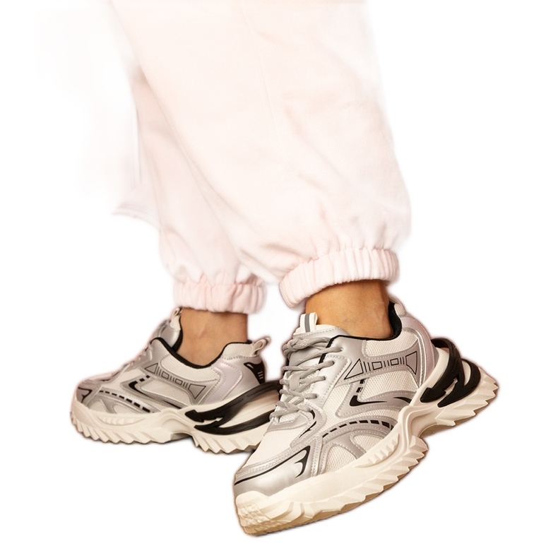 Silver sports sneakers on a thick sole Silver sports sneakers on a thick sole