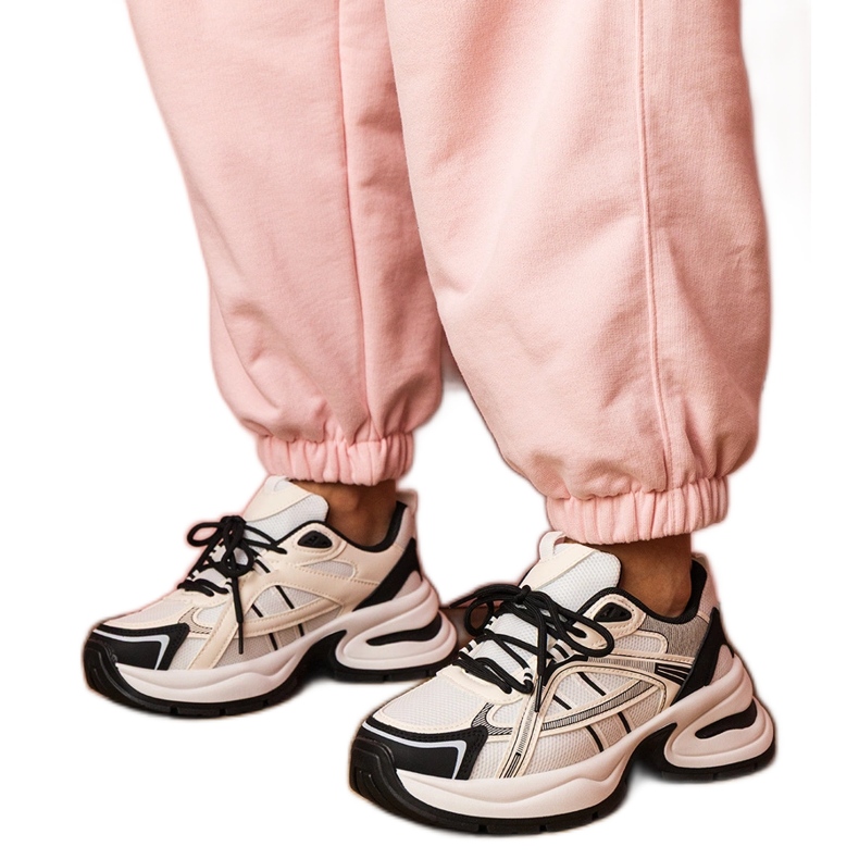 White and white sports sneakers on a massive sole White and white sports sneakers on a massive sole