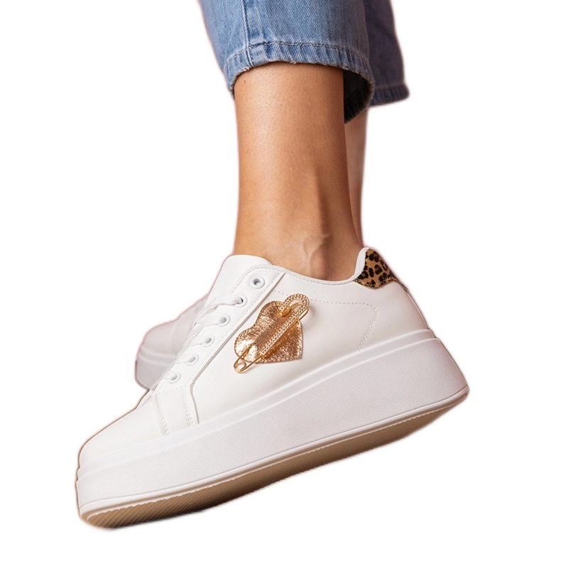White sneakers with a zircon pins and a leopard addition