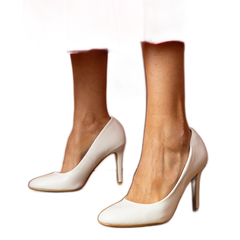 White classic pumps on an eco -leather high heel White classic pumps on an eco -leather high heel