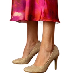 Golden pumps on a brocade finish