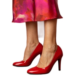 Red classic pumps varnished on a high heel Red classic pumps varnished on a high heel
