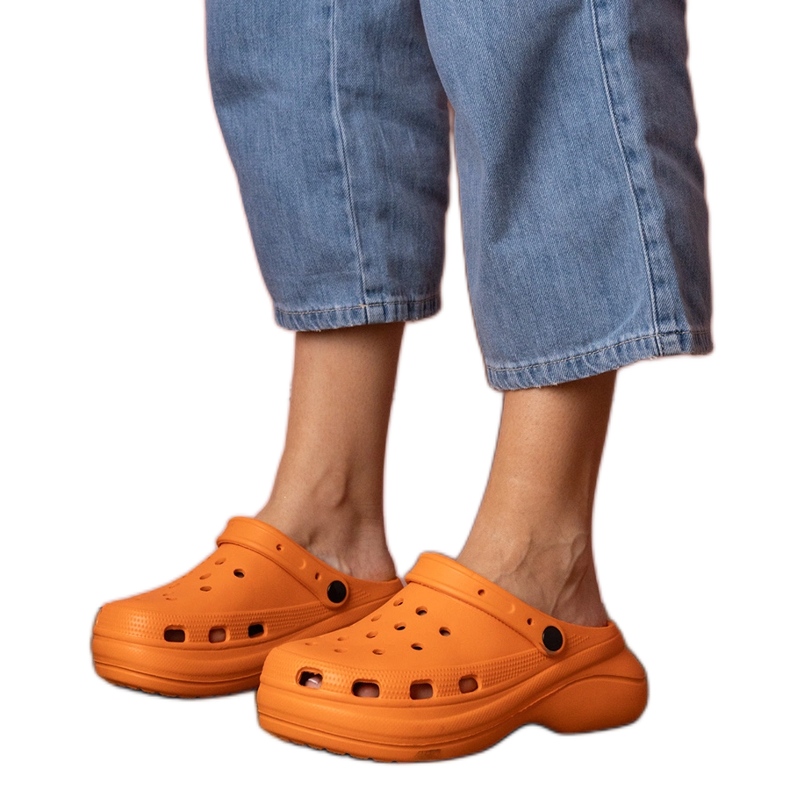 Orange built -up flip -flops on the platform
