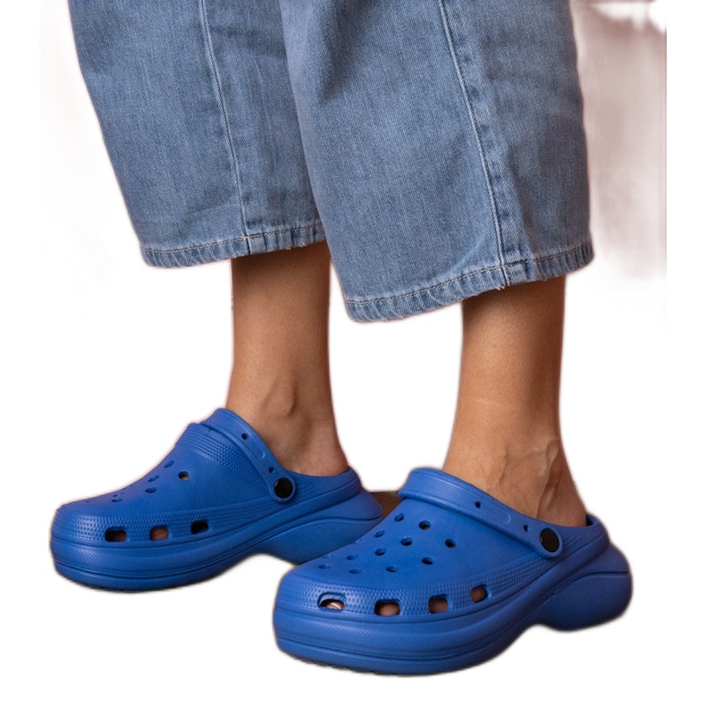 Blue built -up flip flops on the platform