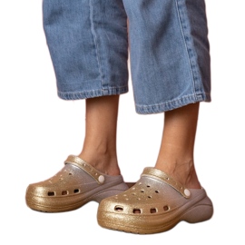 Gold-silver built-up flip-flops on the platform