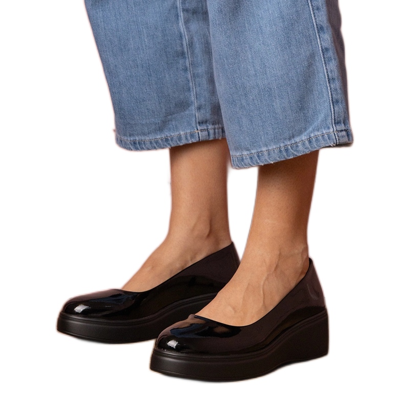 Black shoes varnished on the platform