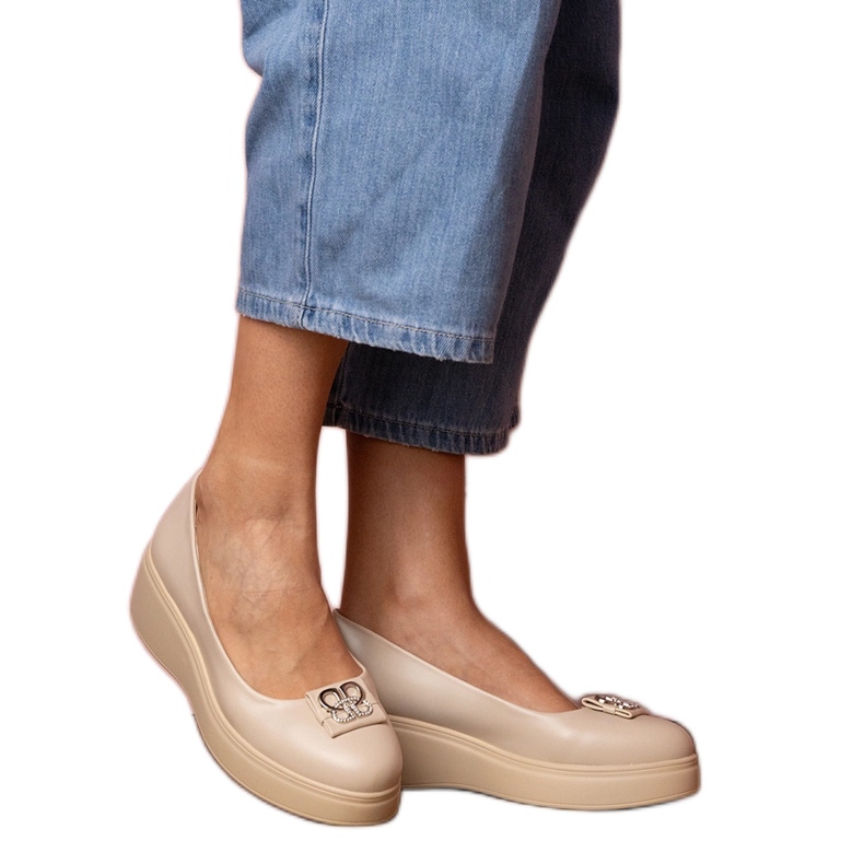 Beige shoes on the platform with a zircon decoration Beige shoes on the platform with a zircon decoration