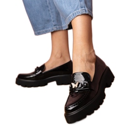 Black varnished loafers with a zircon butterfly