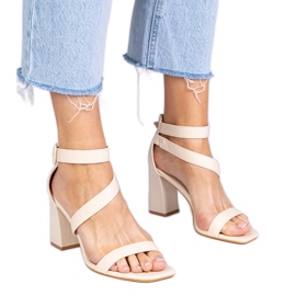 Beige sandals on the post with a buckle Beige sandals on the post with a buckle