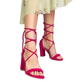 Pink sandals tied on the post