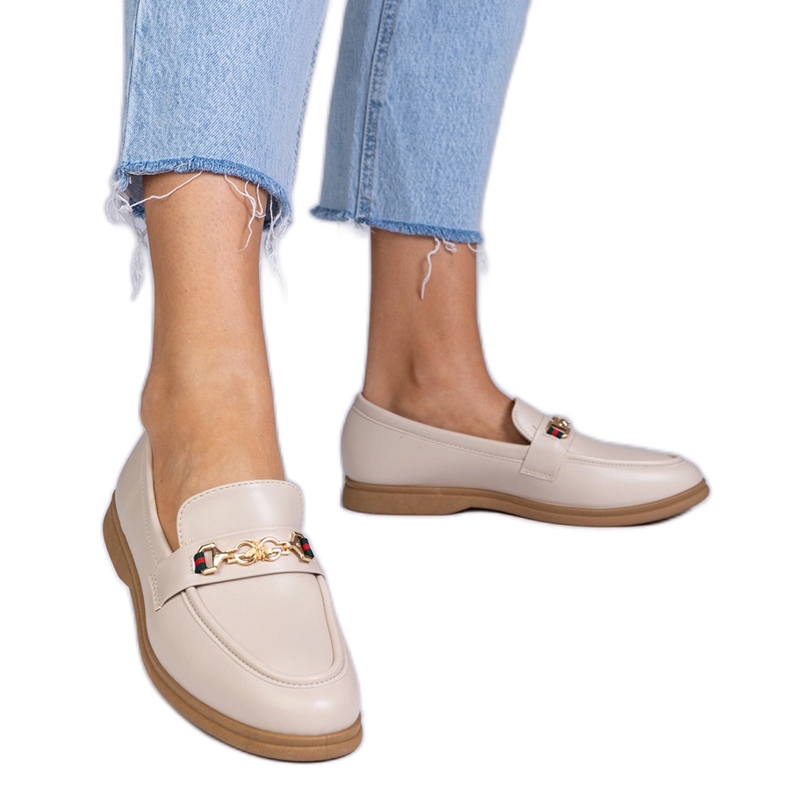 Beige moccasins with gold decoration