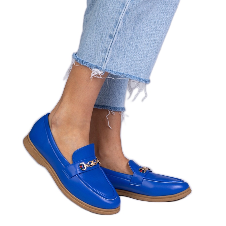 Blue loafers with a golden decoration