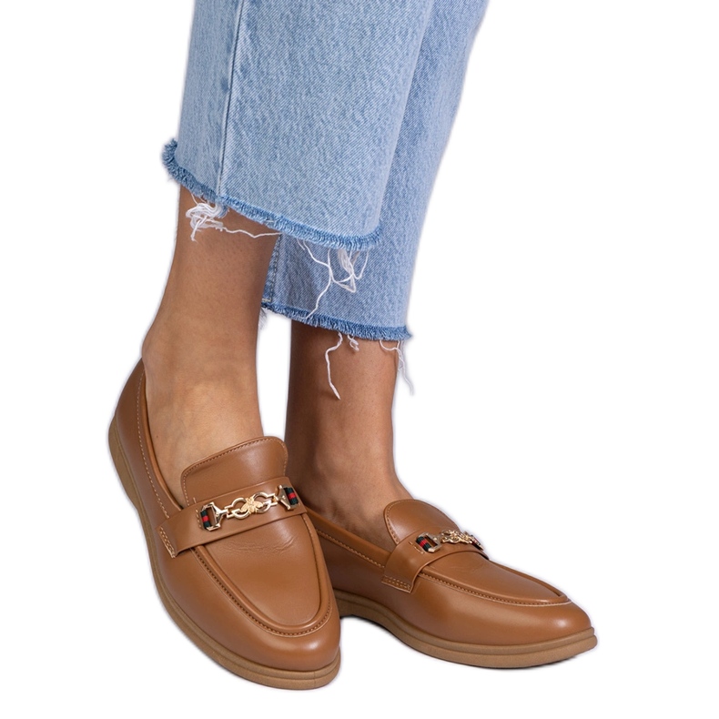 Dark brown loafers with a golden decoration