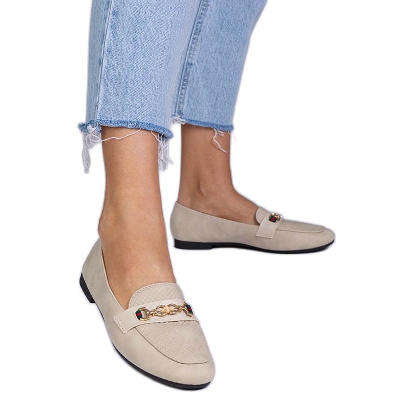 Beige loafers with a matte finish with a golden decoration